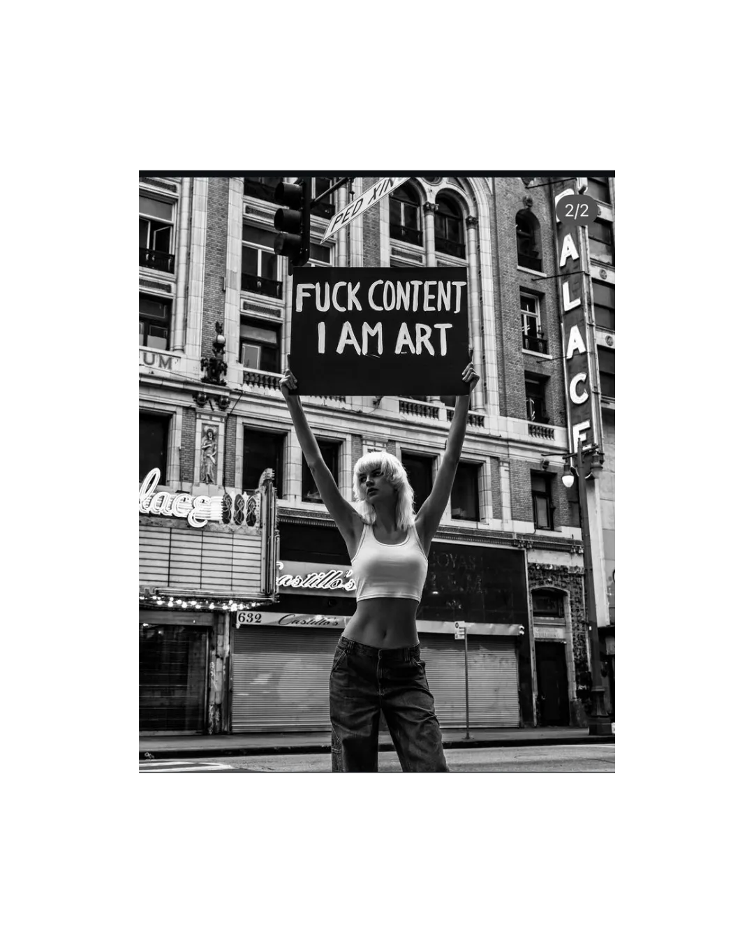 Woman holding sign